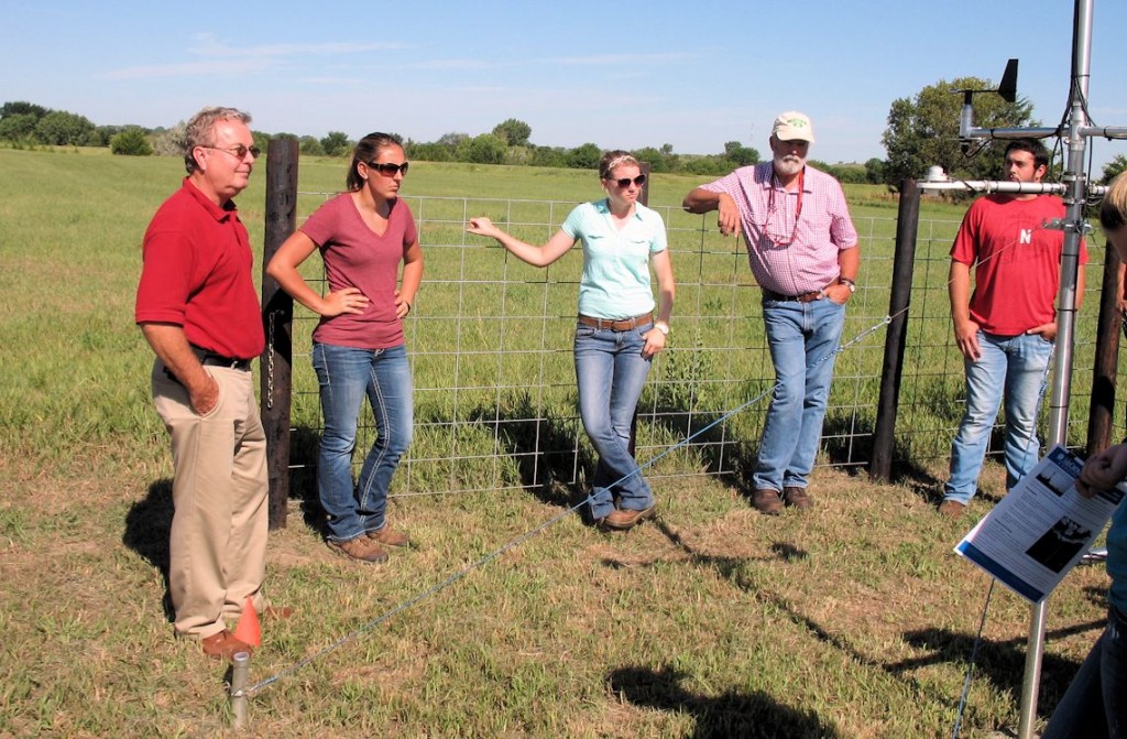Participants in the NRCS tour, including State Conservationist Craig Derickson (at left) listen to an explanation of how data from an automated weather station is used in the E67 irrigation management/telemetry project.