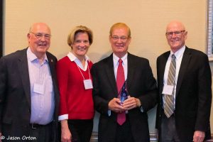 Former State Senator Tom Carlson (second from right) received the Kremer Award at the NSIA/NWRA Annual Convention.  Shown with Sen. Carlson (left to right) are Jim Goeke, selection committee member; Groundwater Foundation Executive Director Jane Griffin; and Don Kraus, selection committee member.